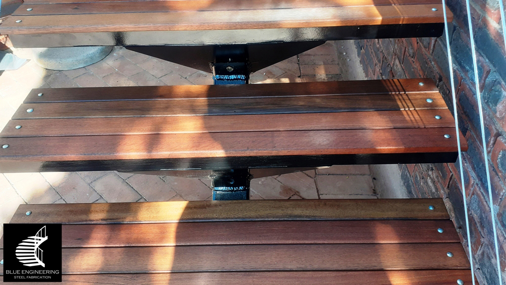 Steel Staircase with Stainless steel cables on the balustrades and Balau Timber Treads